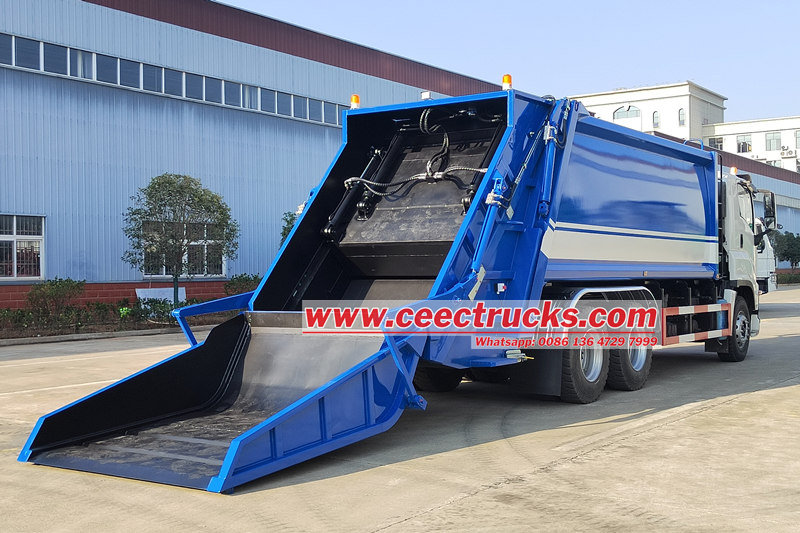 Isuzu trash compactor truck