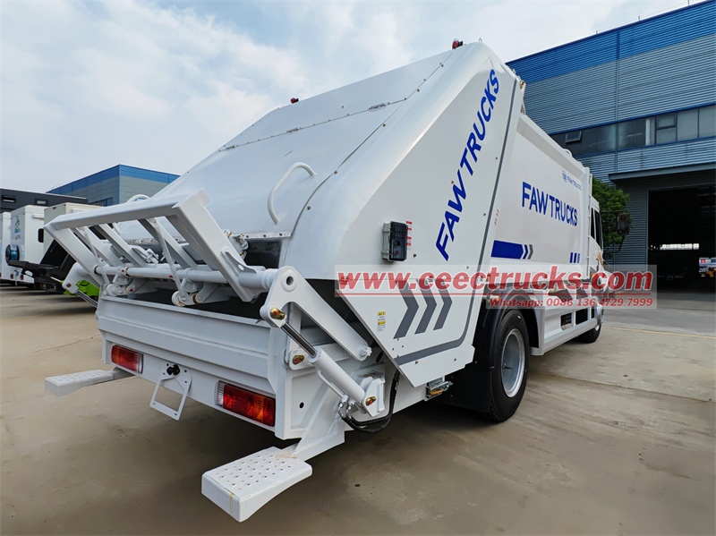 FAW 4x2 RHD hydraulic lifting rear loader truck